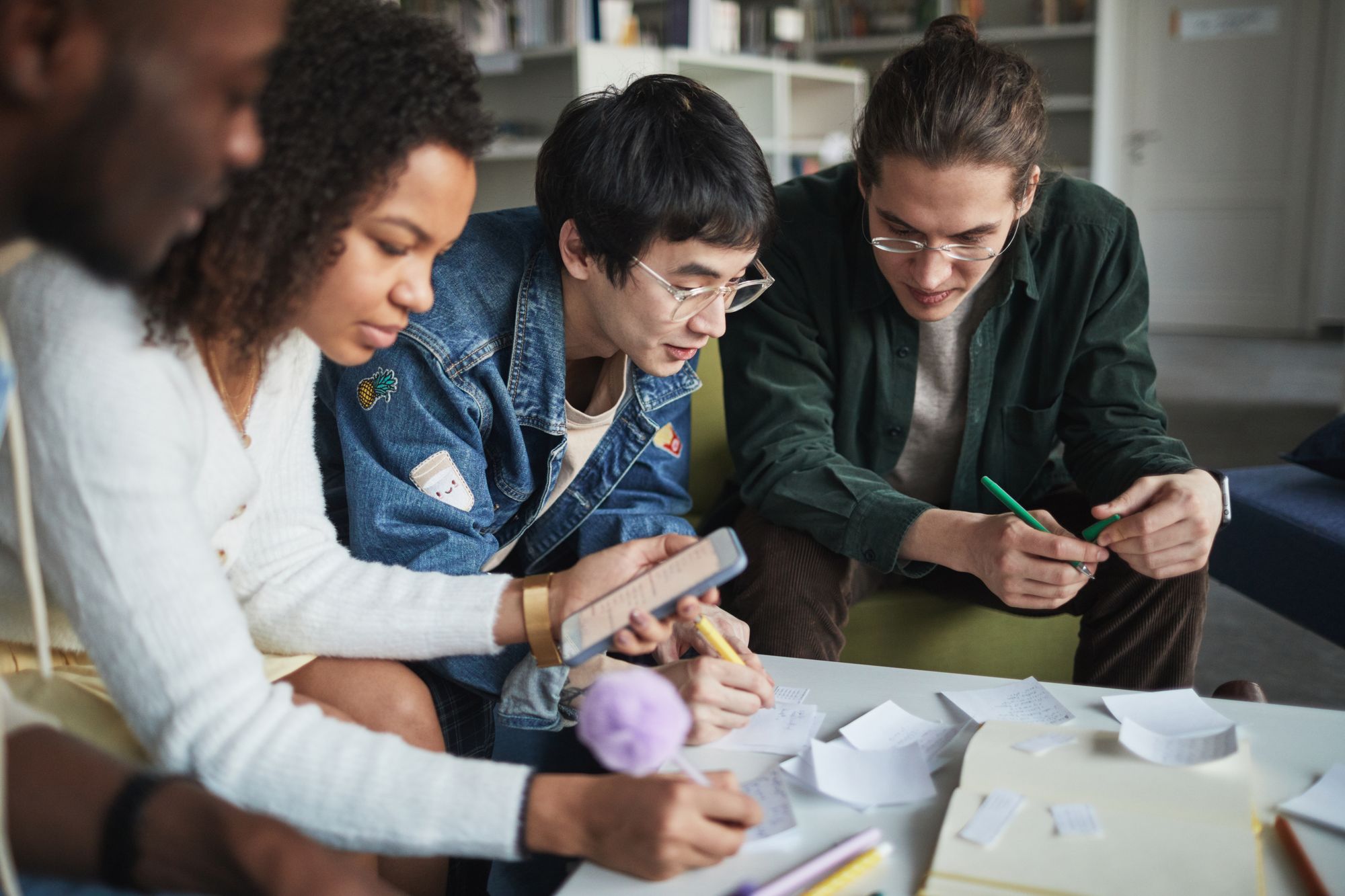 Students building and testing ideas together in a campus library.